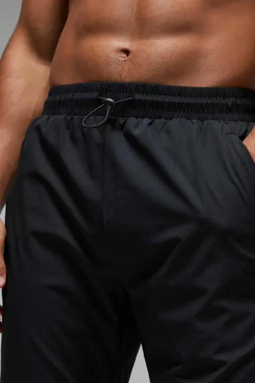 Man Active Shower Resist Tapered Trail Jogger