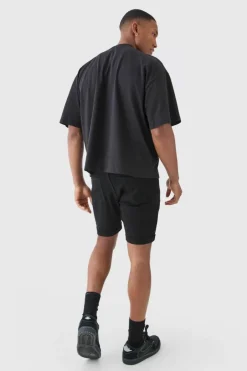 Skinny Stretch Distressed Denim Shorts In Black